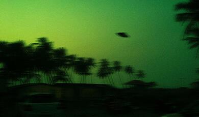 UFO in green sky