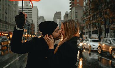 Couple kissing in street