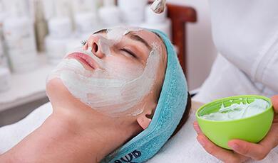 Woman receiving spa facial