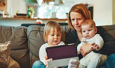 Woman on tablet with kids
