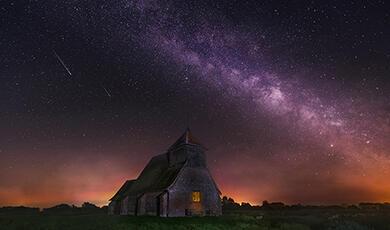 Church with starlight sky behind