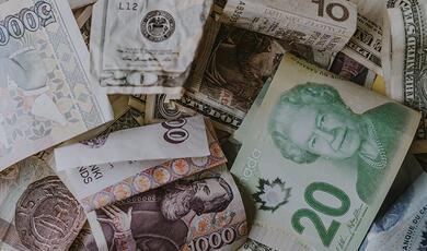 pile of different currency bank notes