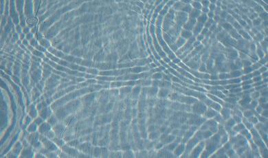 ripples intersecting other ripples on shallow pool