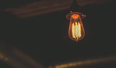 Old fashioned light bulb, dimly lit