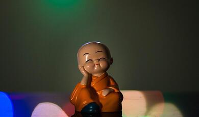 Small figurine of restful Buddhist monk