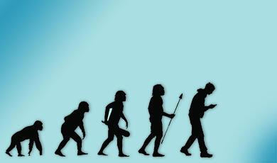 silhouettes of stages of human evolution from chimp to man on a phone