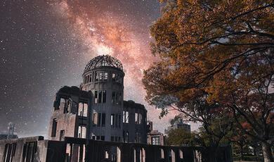 the Atomic Bomb Dome in Hiroshima against a starry sky