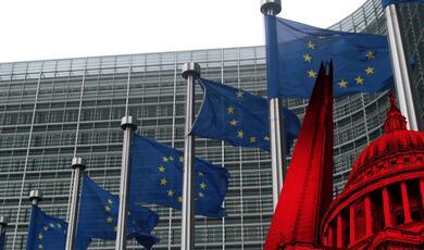 Row of flag poles flying EU flags