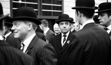 Black and white image of men in bowler hats