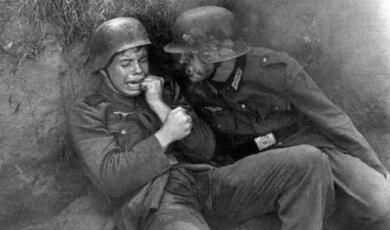 Anguished German soldier and fellow in trench