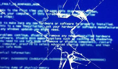 cracked computer screen showing the BSOD