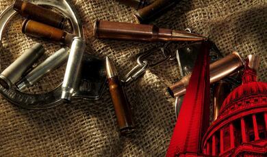 bullets and handcuffs on hessian cloth